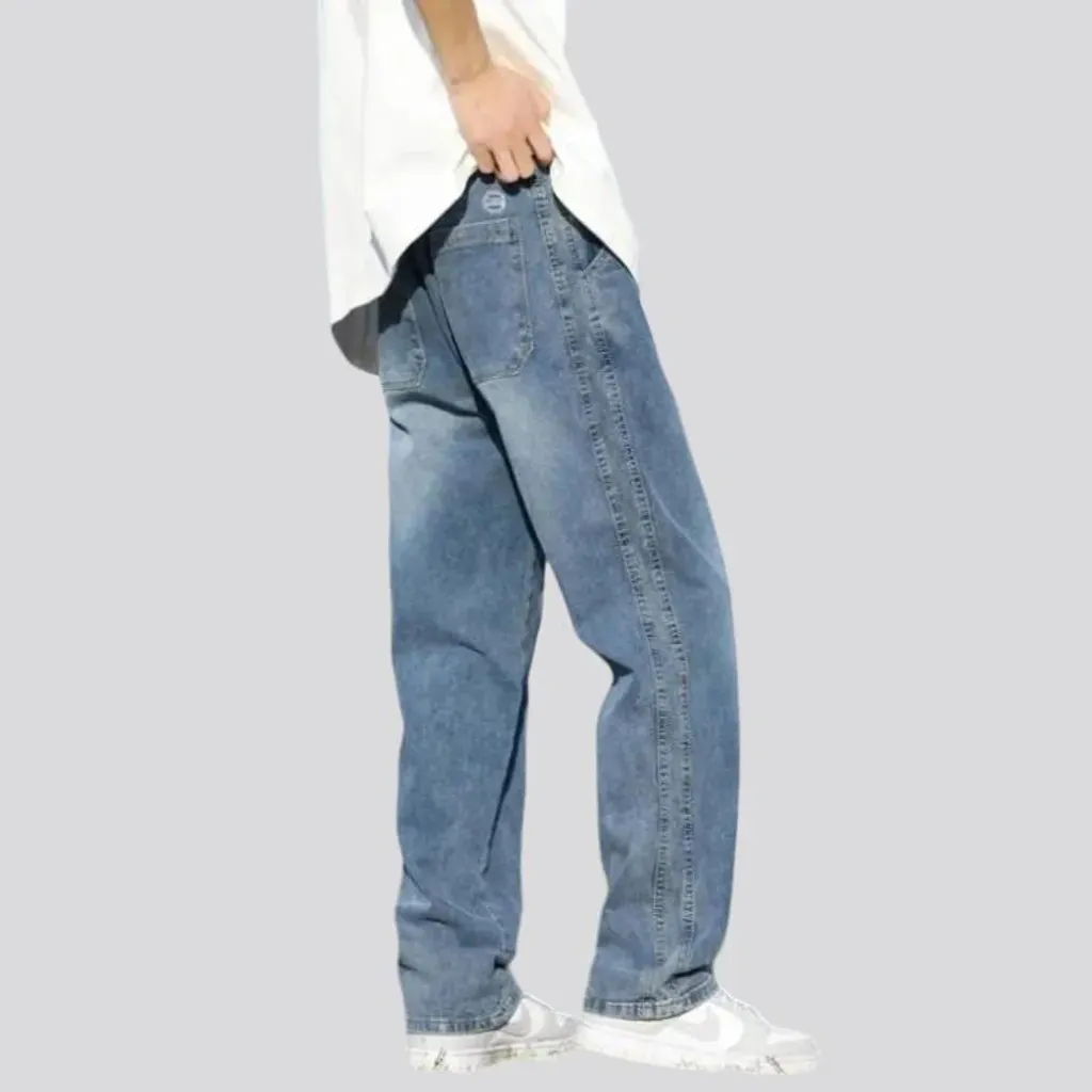 Stonewashed men's floor-length jeans