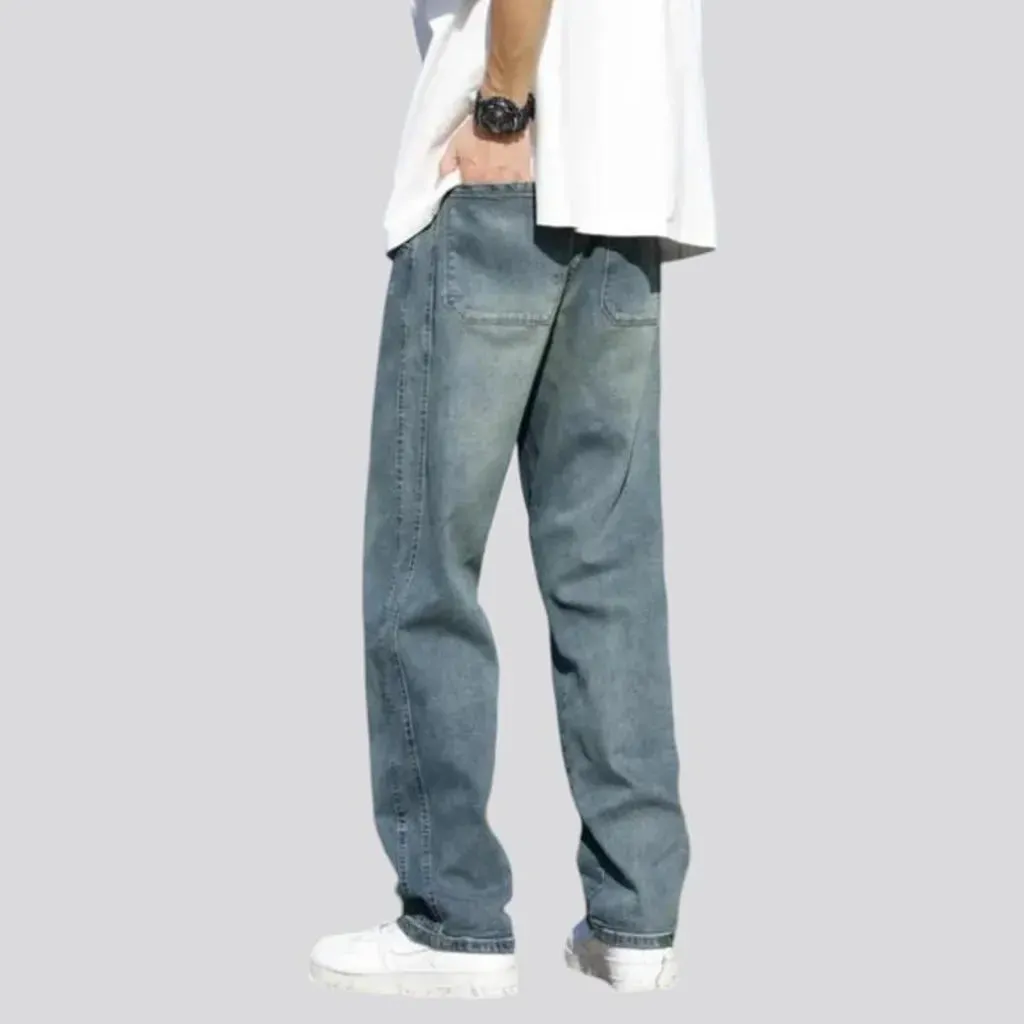 Stonewashed men's floor-length jeans